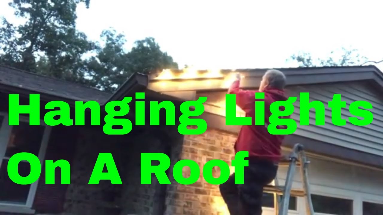 Christmas light installation on shingle roof