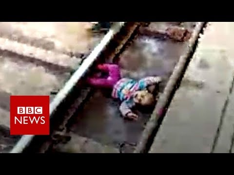 Indian baby's close call with train - BBC News