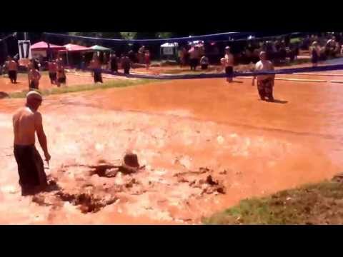 Tim schwanke tackling chad pianalto at mud volleyball
