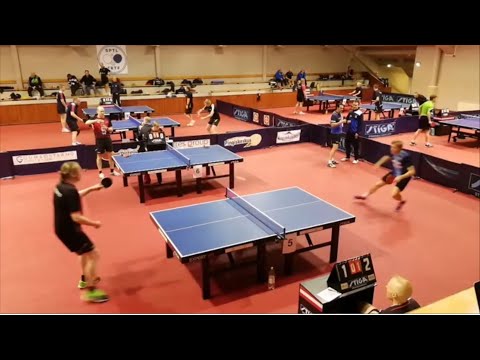 A tricky return by Jarno Virtanen against Juhana Tuuttila