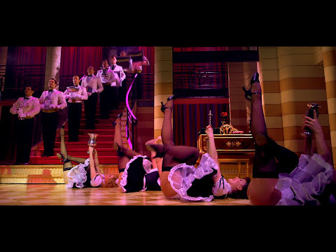 Trailer image with chorus kick-line echoing big brassy orchestrations