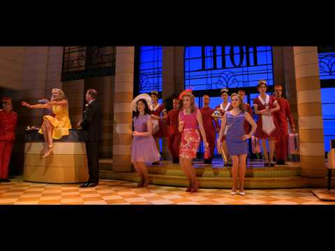 Trailer frame showing casino lights and dance breaks that match the album’s jazzy palette