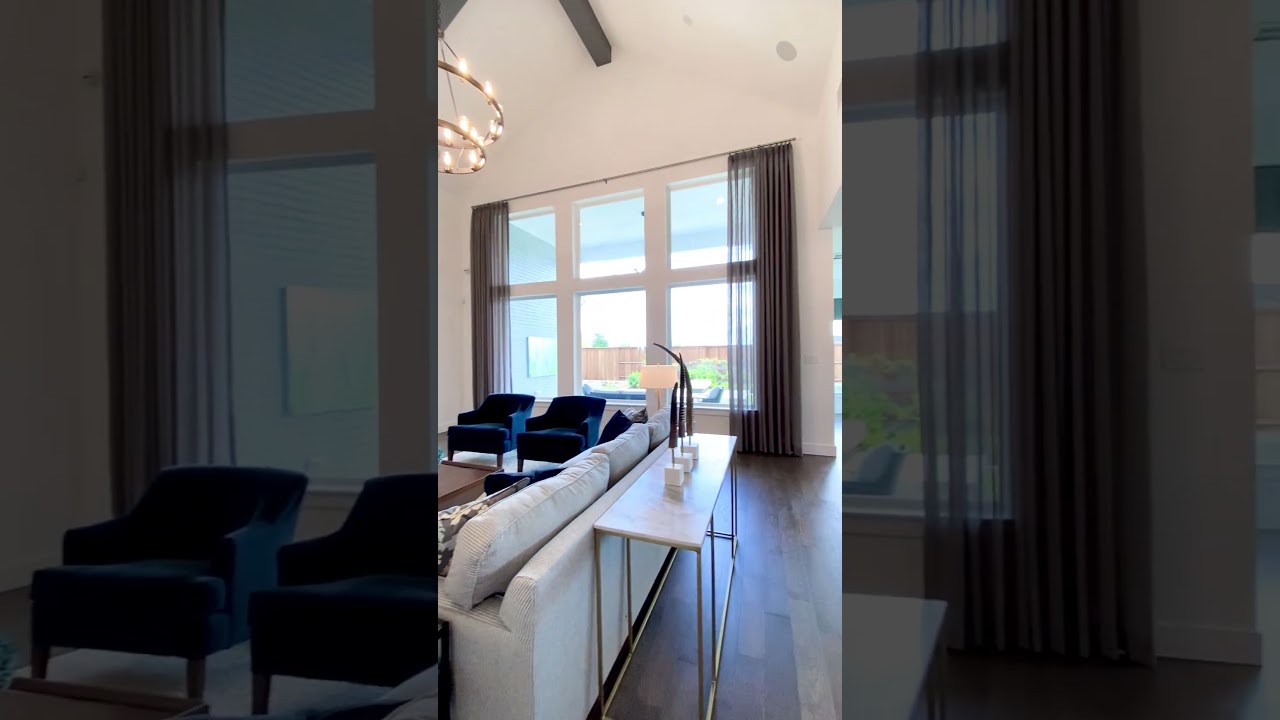 Open Floorplan Living Room with Vaulted Ceiling, and Kitchen with Dark Cabinets - Model Home Tour