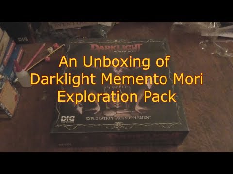 An unboxing of Darklight Memento Mori Exploration Pack