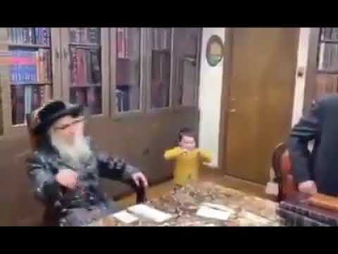 Satmar Rebbe R' Aharon Gives A Child A Lollypop As Was The Custom Of His father The Beirach Moshe