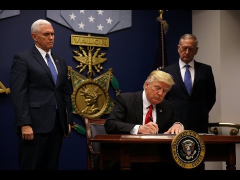 Trump signs order limiting refugees