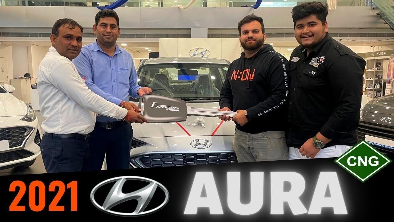 Taking Delivery of Hyundai AURA with travelling Bear