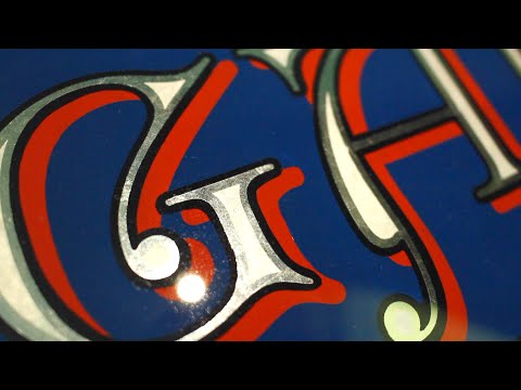 Sign Painting & gilding a traditional glass sign, using 12kt. white gold leaf & acid etching