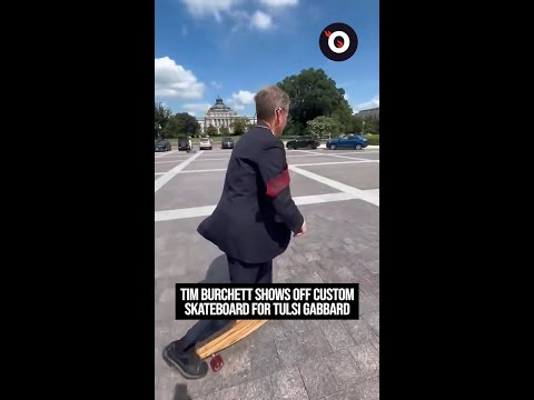 Tim Burchett shows off custom skateboard for Tulsi Gabbard