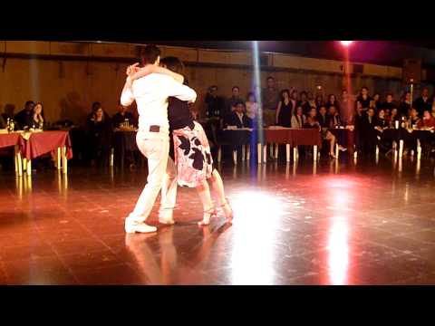  Javier Rodriguez  and  Maria Florencia Labiano  are  dancing  to  the  tango  "  Esta Noche De Luna  "