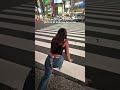 Girl Walks Through Tokyo's Famous Shibuya Crossing In Japan
