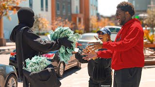 Polite Bank Robber Gives Away Money