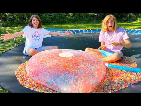 TRAMPOLINE vs GIANT ORBEEZ WATER BOMB! (500,000 water beads!)