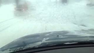 Driving down a snowy Loring Avenue in Salem, Mass.