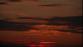 aerial view of wonderful storm tropical clouds and orange golden sun at sunset cloud sca