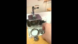 How to pull apart and reassemble the bobbin case area on a front loading sewing machine
