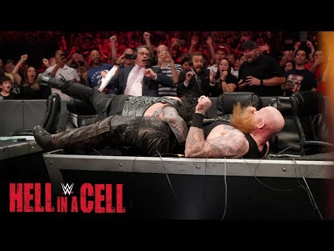 Roman Reigns Spears Erick Rowan through the announce table: WWE Hell in a Cell 2019