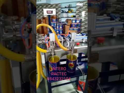 Double nozzle liquid filling machine