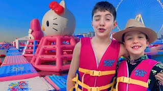 Water Park Adventure for Kids 💦 World’s Largest Inflatable WaterPark ☀️ Family Fun
