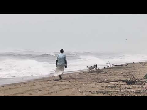Walking in beach during storm