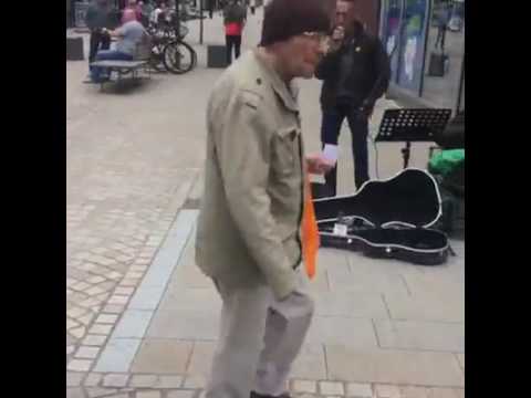 Thumbnail for Mike Joyce drops some money to a busker by Mike Joyce