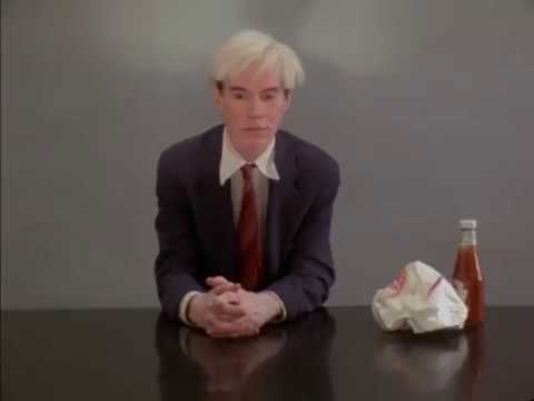 Andy Warhol performing: eating a hamburger 1982