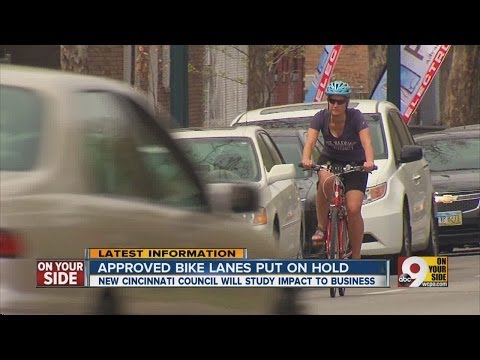 Cyclists, businesses argue over bike path