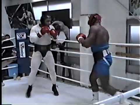 Oliver McCall lands a bomb on Mike Tyson