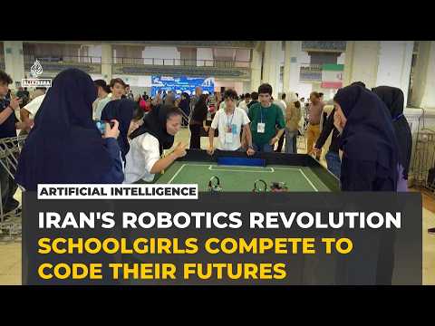 Iranian schoolgirls compete in robot football at Tehran's RoboCup
