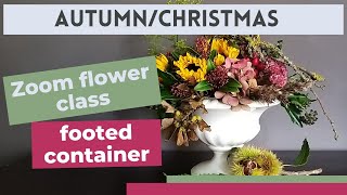 Flowers in a footed container