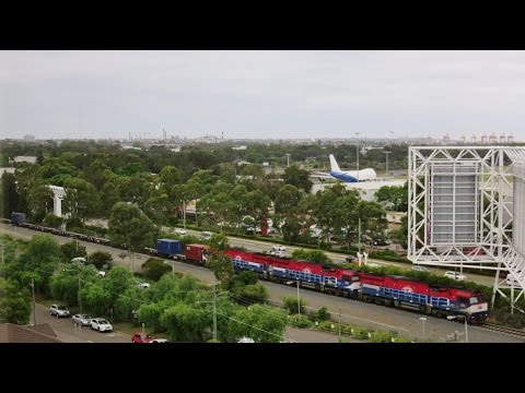 Triple FIE class locos pass Sydney Aiport with #1847 Port Botany to Dubbo 'Fletchers' train