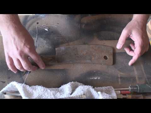 restoring an old broken antique rusty meat cleaver