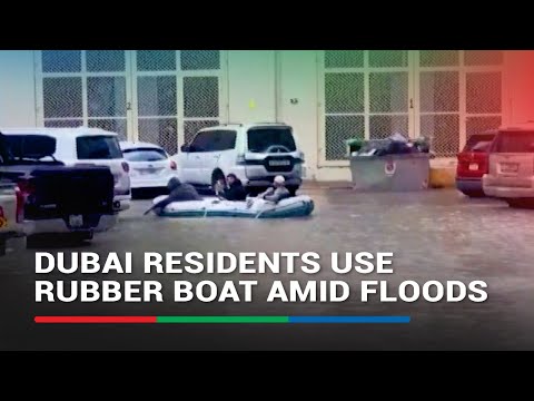 Dubai residents use rubber boat amid floods