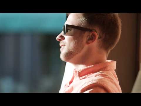 Phonak Naida V wearer & comedian D.J. Demers preforms on stage with hearing aids