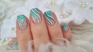 Gel polish ombre with sugared nail art. Snowflakes nail design over natural nails