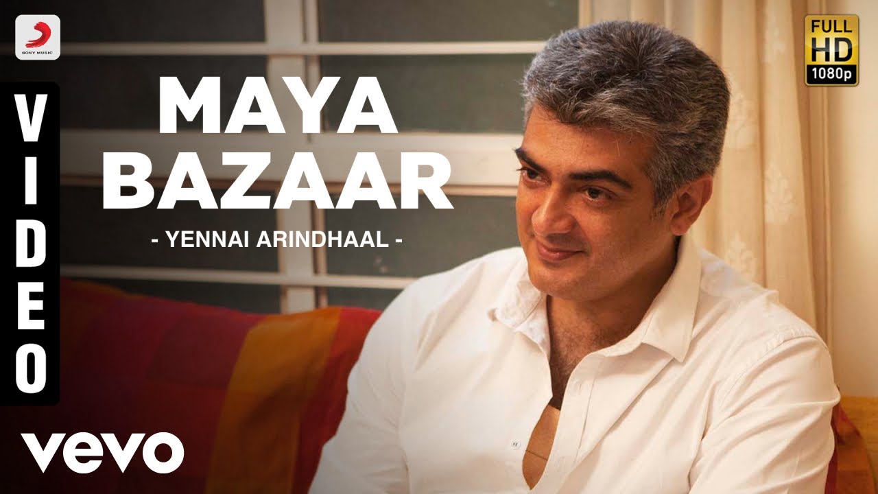 Maya Bazaar Lyrics  | Yennai Arindhaal | Aalap Raju, Krishna Iyer, Velmurugan | Harris Jayaraj