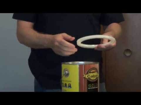 Part of a video titled How to Remove Paint Can Lid Locks - YouTube
