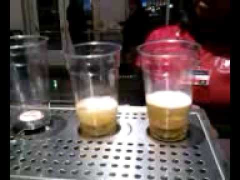 Draft beer fills cup from the bottom to the top.