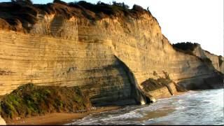 preview picture of video '[HD] Sunset at Sunset Beach Logas at Peroulades under the cliffs in Corfu 10/2009'