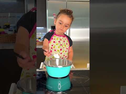 3-year-old making Banana Blueberry Muffins