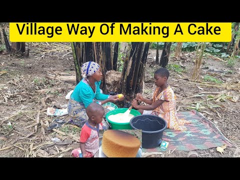 VILLAGE WAY OF MAKING A CAKE USING  SAND AND FIREWOOD  IN AFRICA UGANDA