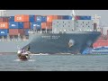 Small Wooden Boats Maneuvering Around Giant Ship Waves