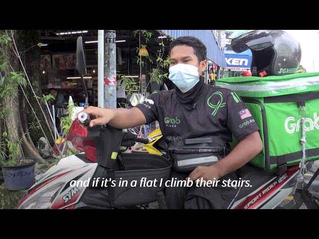 Disabled delivery rider on ‘frontline’ of Malaysian virus war