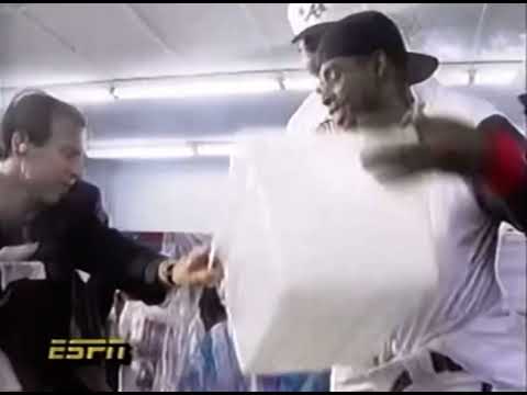 Deion Sanders throws a bucket of water on a reporter (1992)