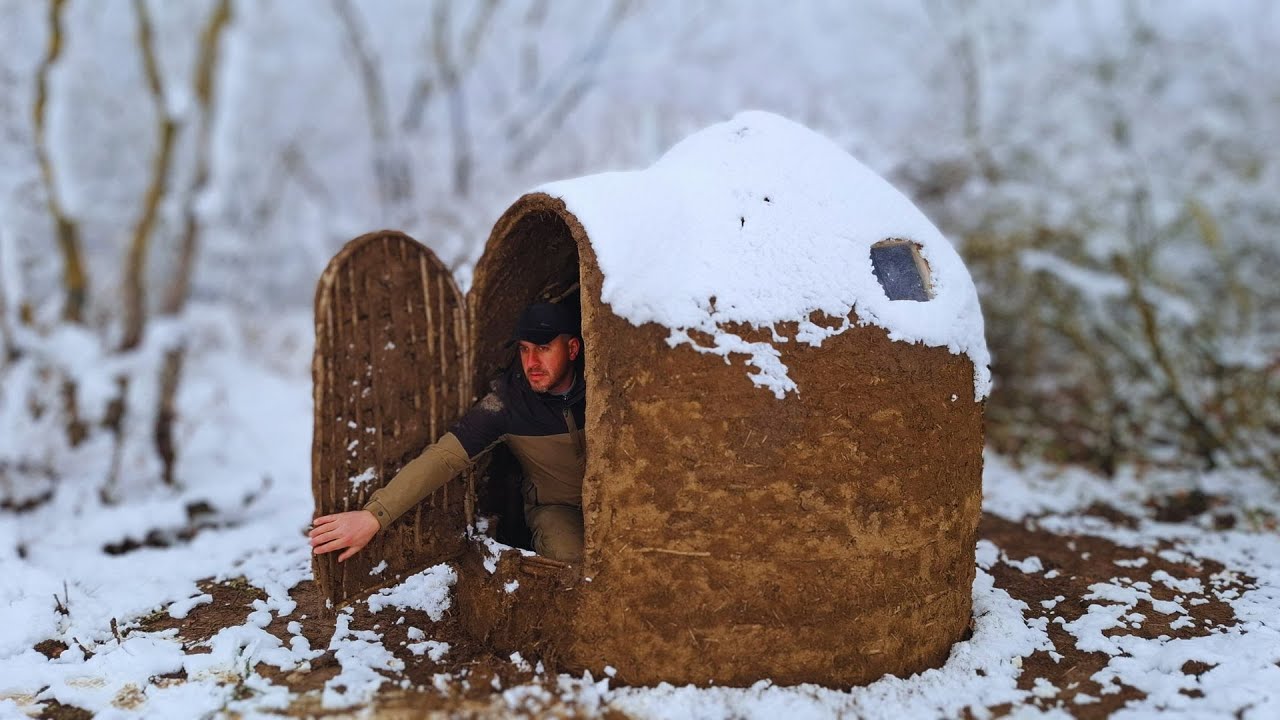 Building a bushcraft shelter for winter survival in the wilderness