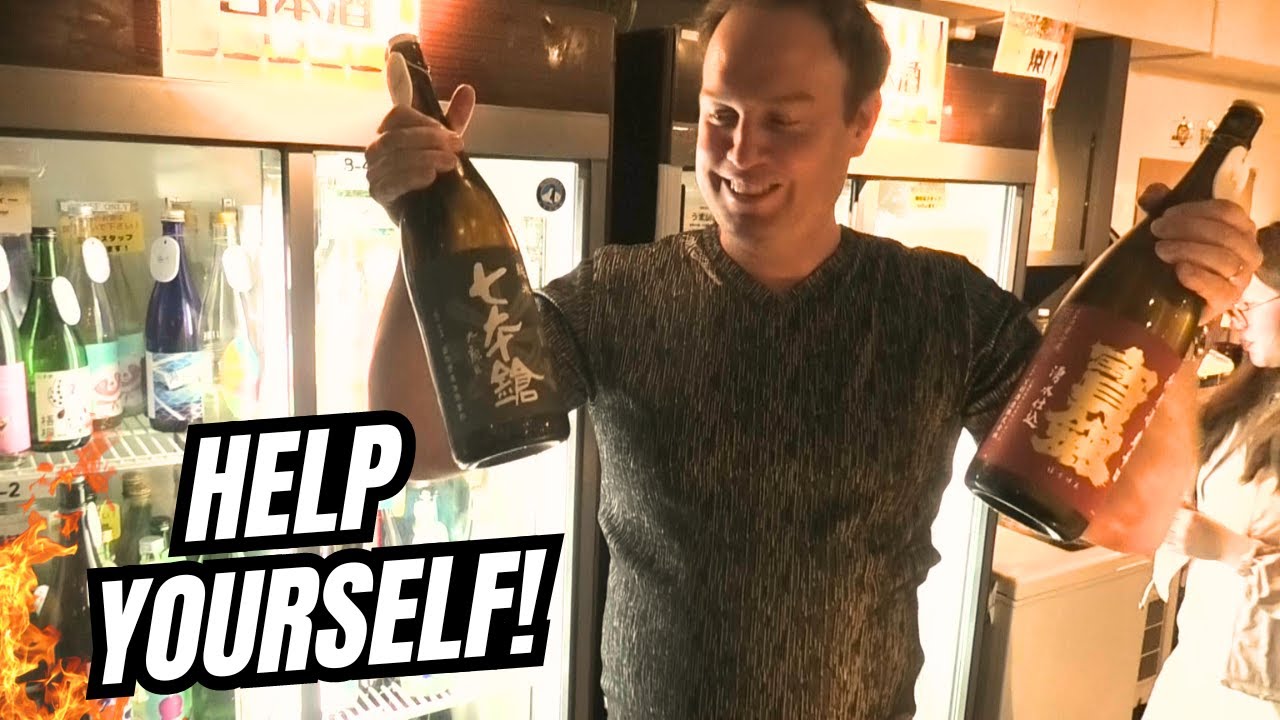 Experience a tourist's thrilling journey through a traditional sake bar in this captivating video.