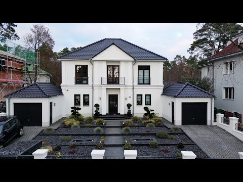 Moderne Stadtvilla mit Walmdach und Stuck Applikationen