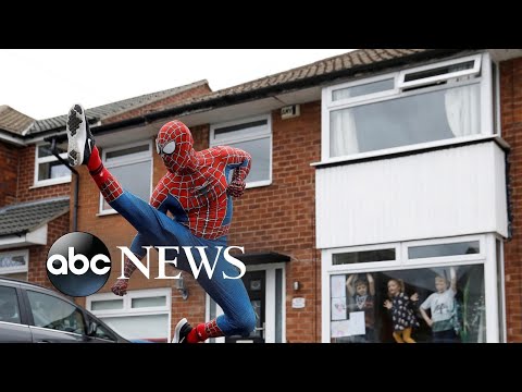 Spiderman, constructing a field hospital, burying the dead: World in Photos, April 2