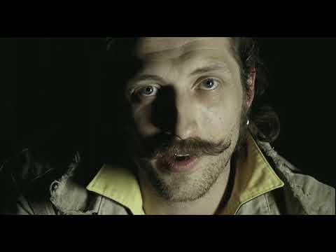 Filth and Wisdom trailer still with A.K. (Eugene Hütz) addressing the camera, London night exteriors
