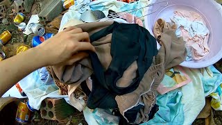 Sorting clothes at the scrap yard-スクラップ置き場に残された衣類を分別する